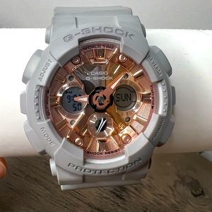 Rose gold chrome G shock watch with grey band